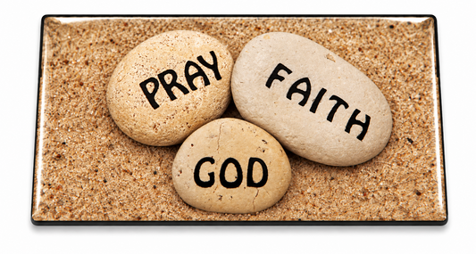Pray, Faith and God stones centered on beach sand in a clear domed belt insert